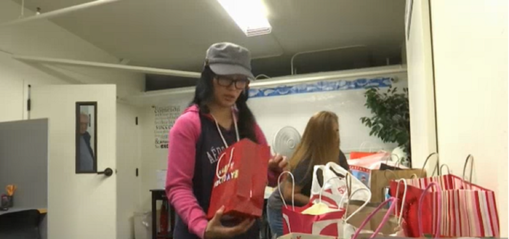 Maybelle prepares flowers and gifts on Mother’s Day at Safe Harbor Shelter.