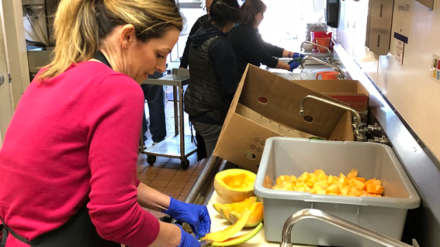 Woman preparing a cantaloup