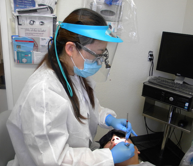 Dental Hygienist working